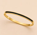 Noir Crystal Armreif – Gold